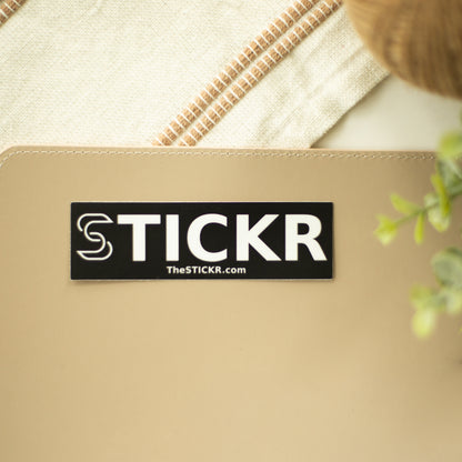 rectangle STICKR logo on table