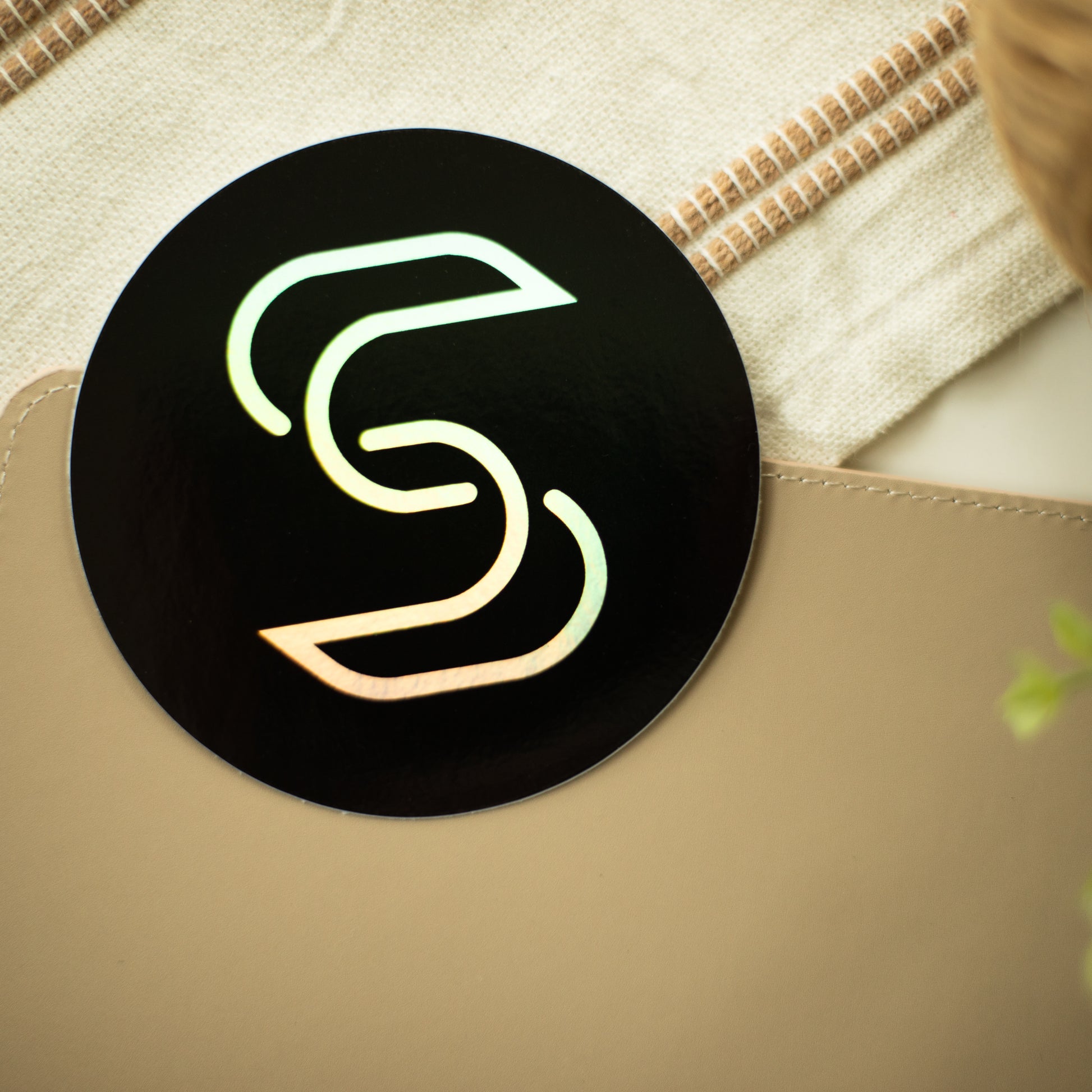 Holographic STICKR logo on table