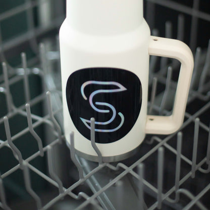 A holographic sticker of the Stickr logo on a water bottle in a dishwasher